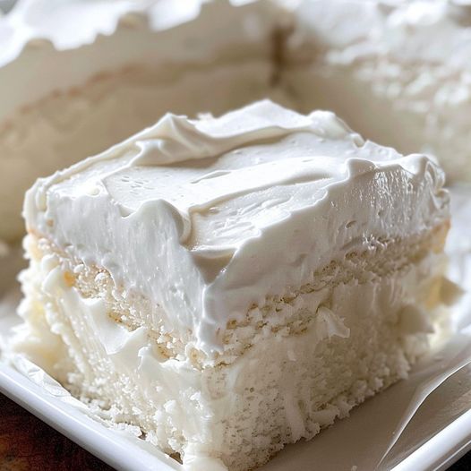 a light, fluffy cake with a rich, buttery taste that perfectly captures the understated beauty of a traditional white cake.